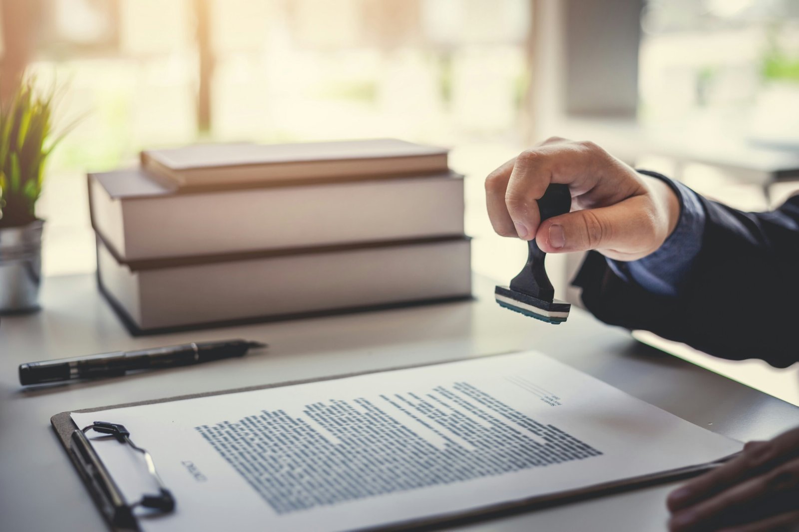 Man stamping something issuing a guarantee