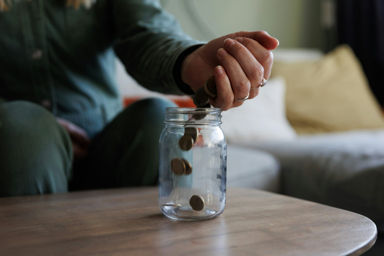 Man saving pennies and pounds