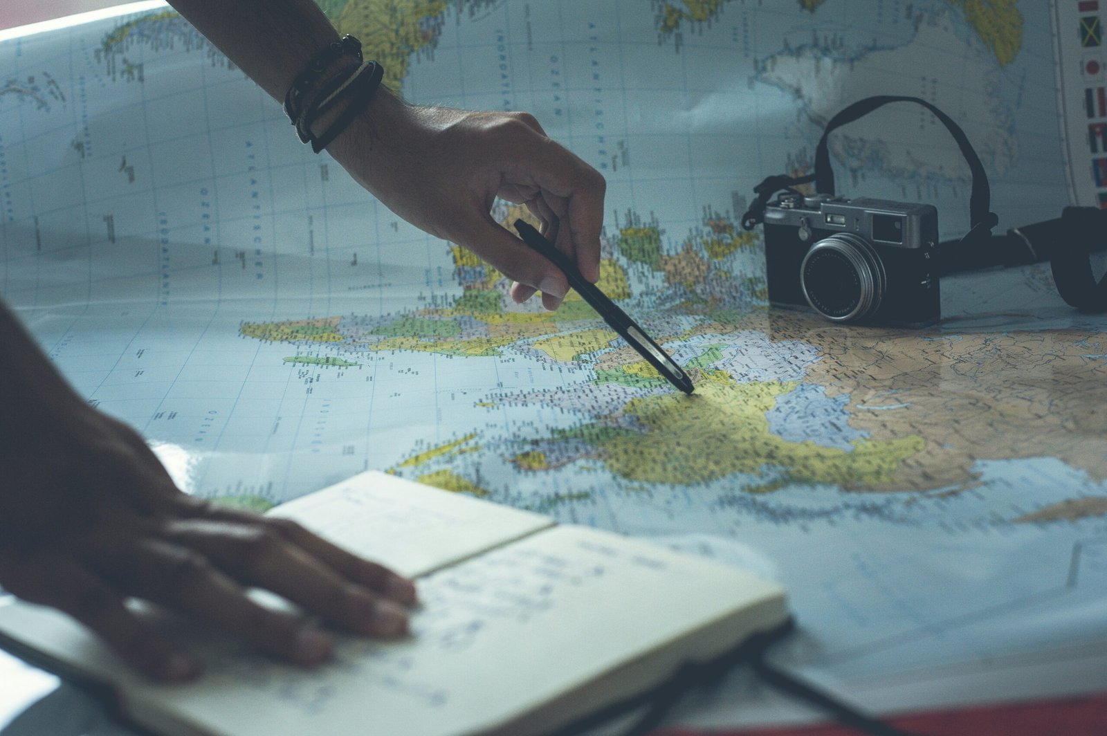 Man with notepad looking at a map