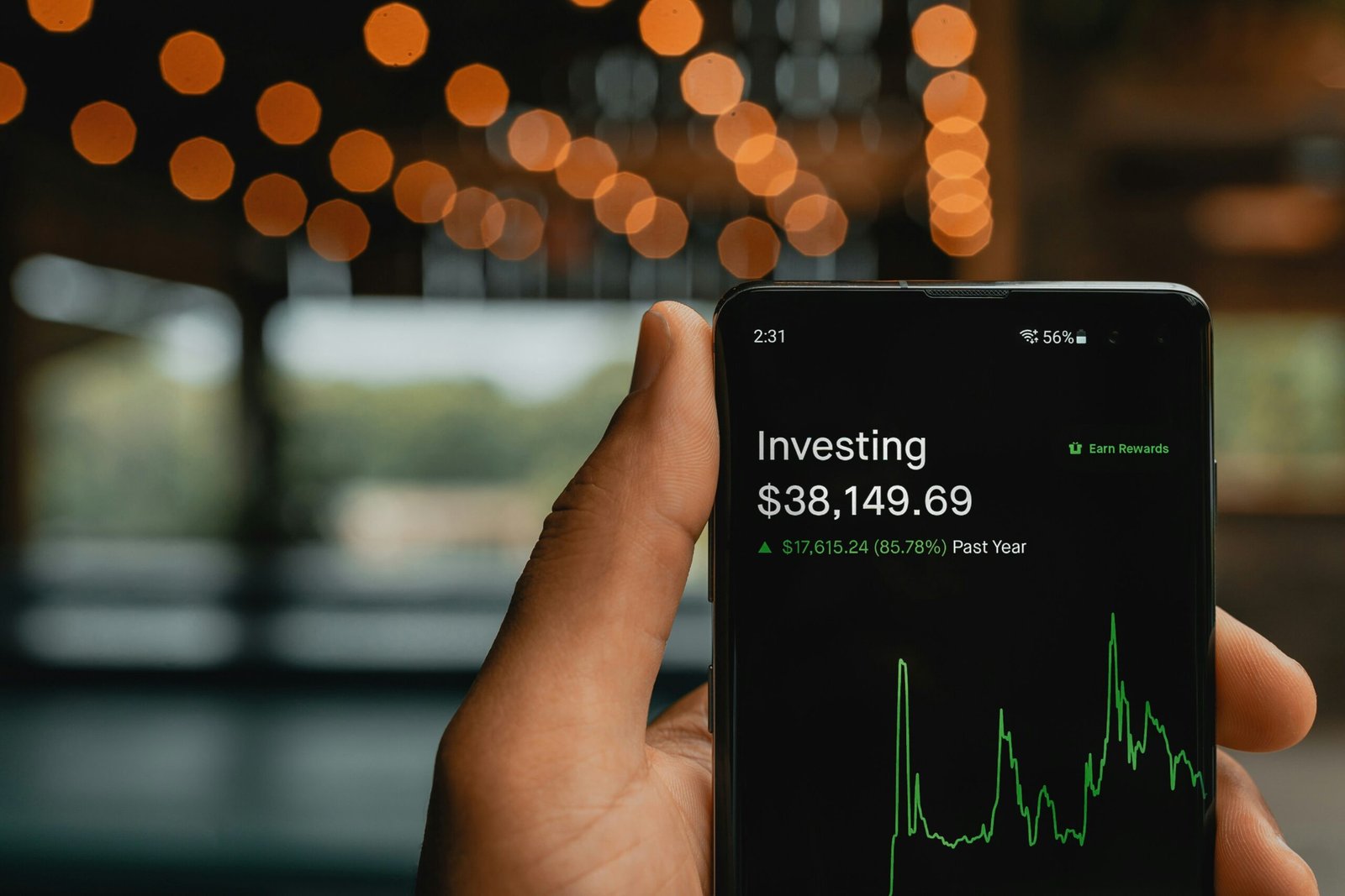 Man with stocks on his phone